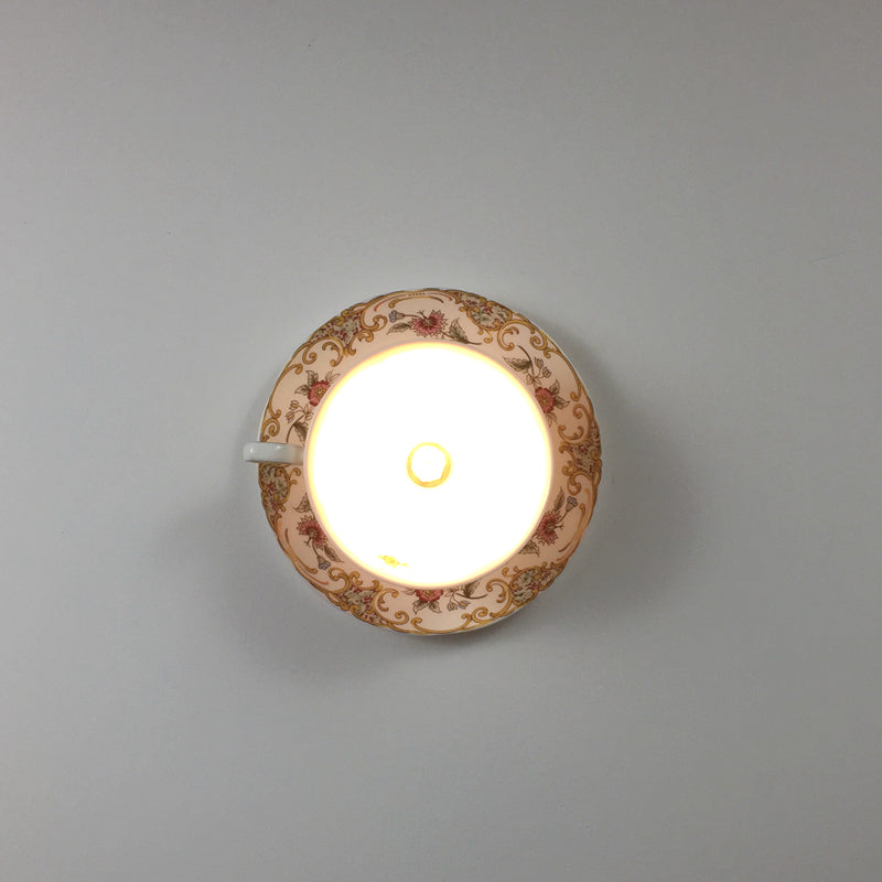 Chic ceramic flush mount light fixture showcasing modern design and illumination in a cozy living room.