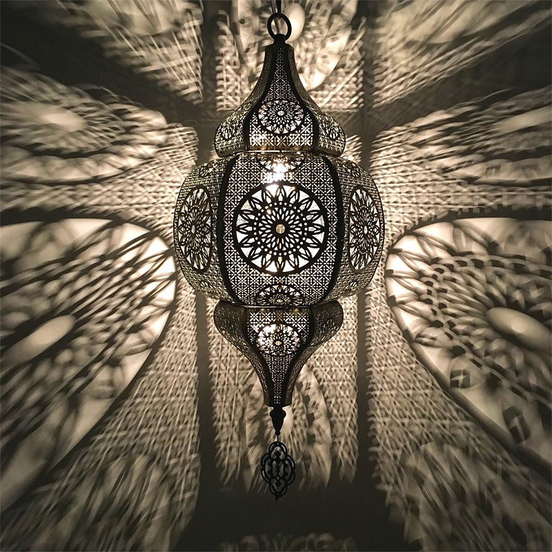 Moroccan vintage light fixture illuminating a cozy patio space.