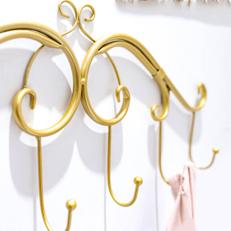 The RetroWall™ coat rack in a modern bedroom setting showcasing space-saving design for entryway furniture