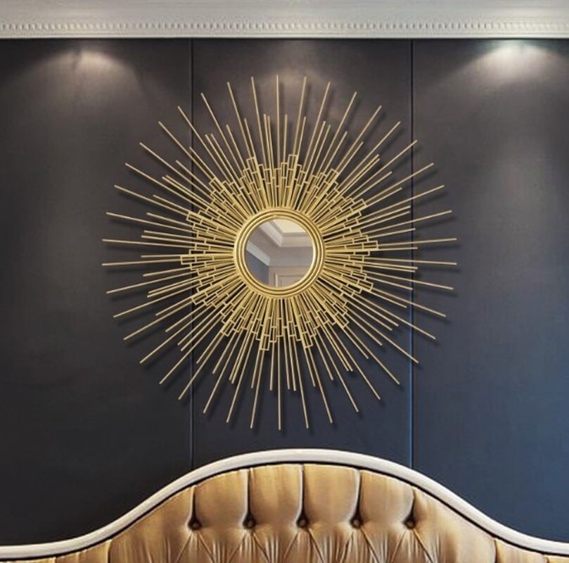 Victorian gold wall mirror displayed in a stylish living room setting, adding elegance.