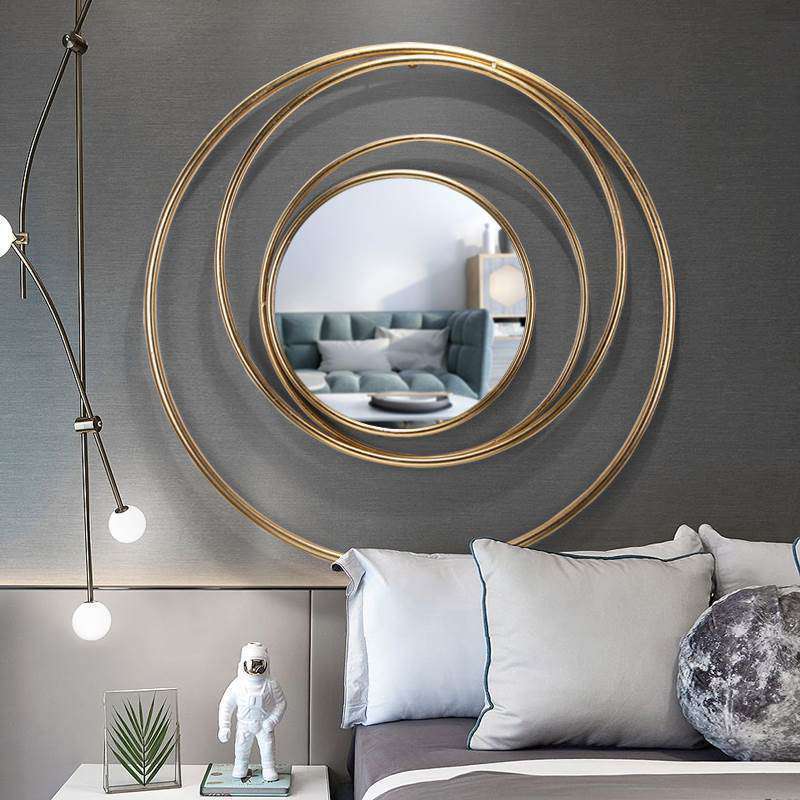 Elegant European Gold Circle Mirror hanging in a stylish living room with natural light.