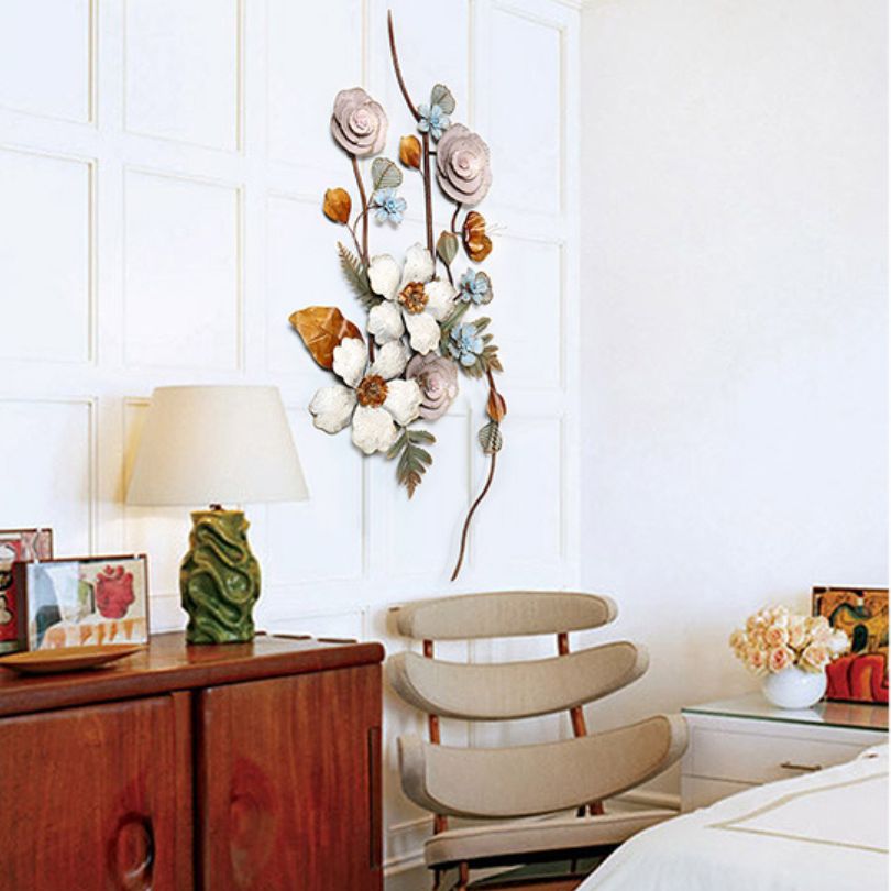 Front view of elegant European wrought iron wall art in a living room setting.