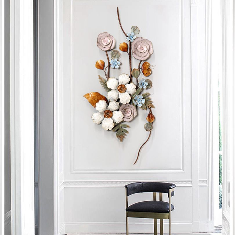 Front view of elegant European wrought iron wall art in a living room setting.