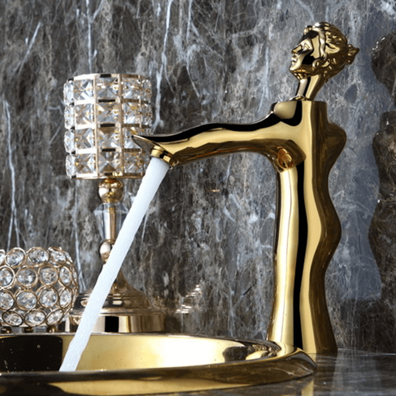 Close-up of the gold faucets handle, demonstrating its smooth operation and artistic details.