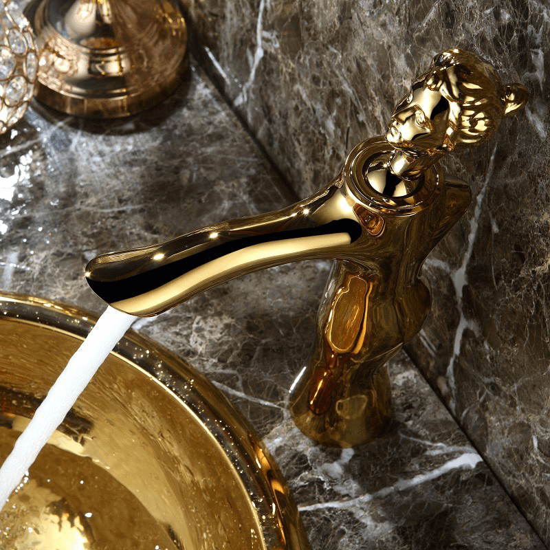 Elegant Goddess Gold Faucet from a side angle showcasing its unique figurine design.