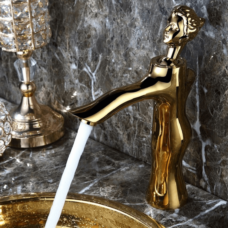 Elegant Goddess Gold Faucet from a side angle showcasing its unique figurine design.