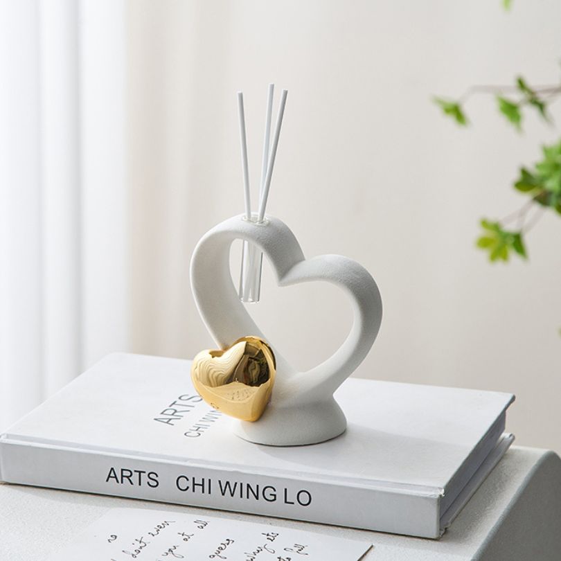 Side view of the ceramic love ornament highlighting its unique design and craftsmanship.