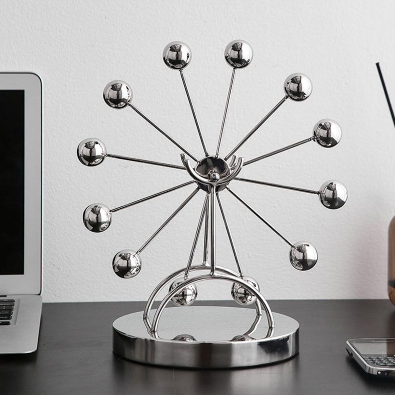 Ferris wheel desk decor on a stylish home office desk, enhancing the workspaces creative vibe.