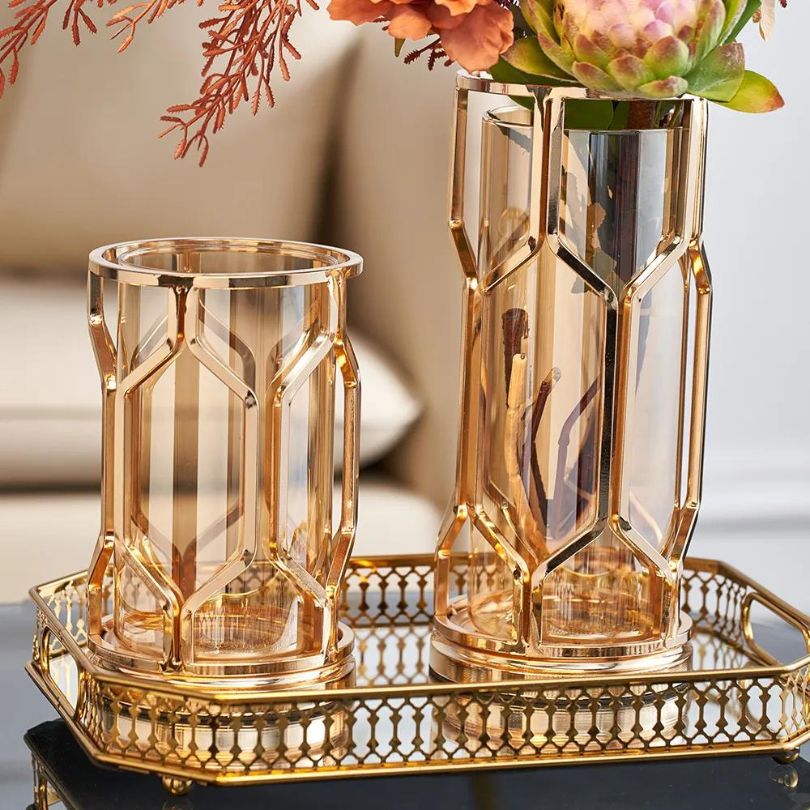 Elegant golden glass vase in a living room setting, enhancing the decor.