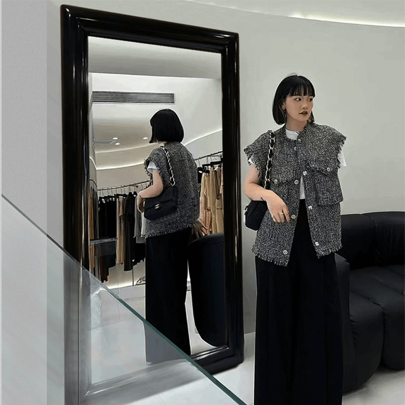 Close-up of the stylish wooden frame of the black frame floor mirror highlighting its craftsmanship.