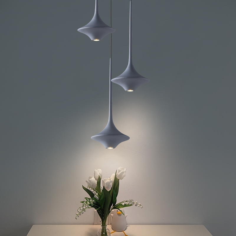 Unique pendant light hanging in a stylish bar, demonstrating its versatility and contemporary aesthetic.