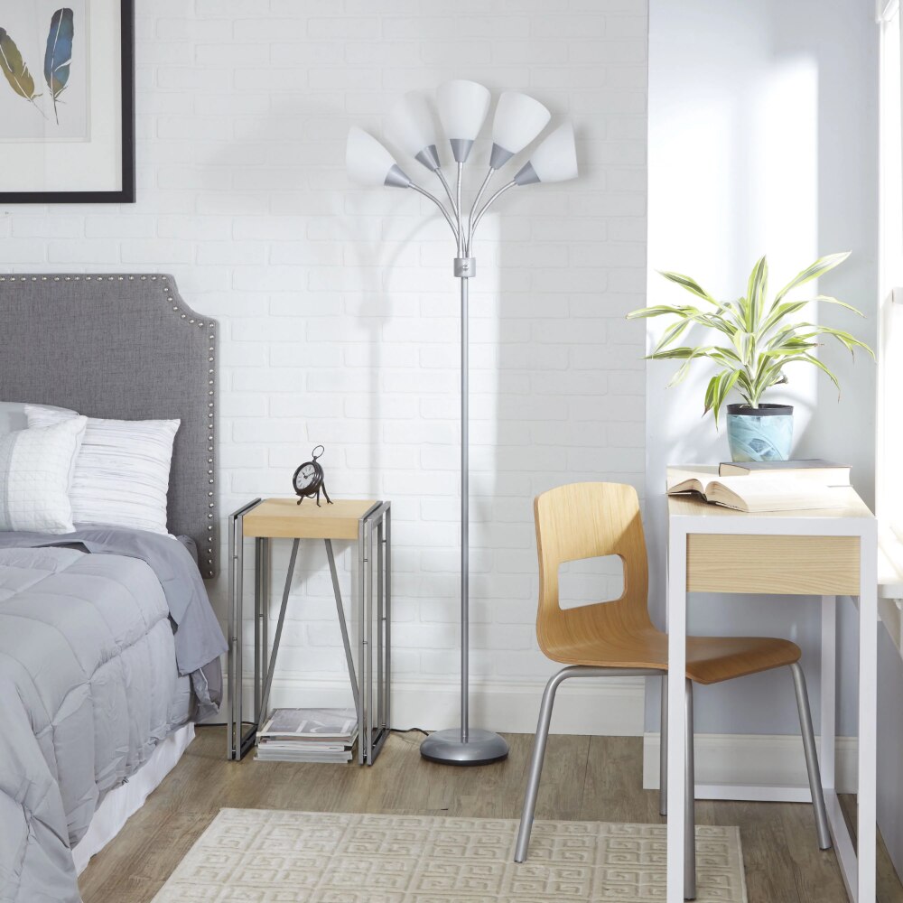 Close-up of the sleek design of the stylish floor lamp, highlighting the glossy silver finish and tulip-shaped shades.