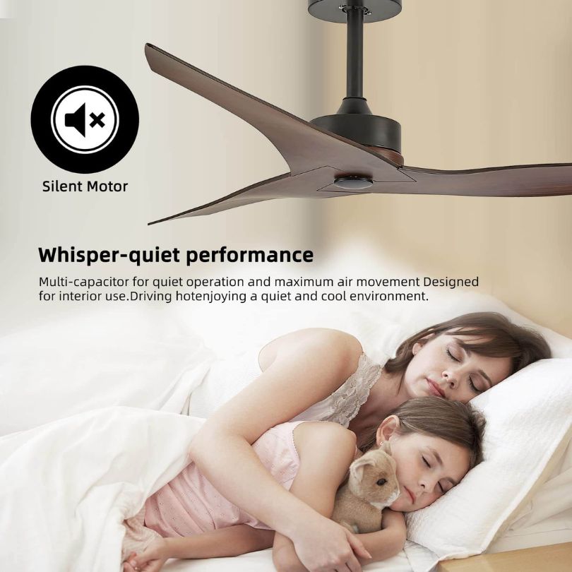 Angled view of reversible ceiling fan mounted in farmhouse-style living room