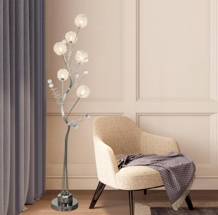 Dimmable floor lamp illuminating a cozy bedroom setting, demonstrating its versatility.