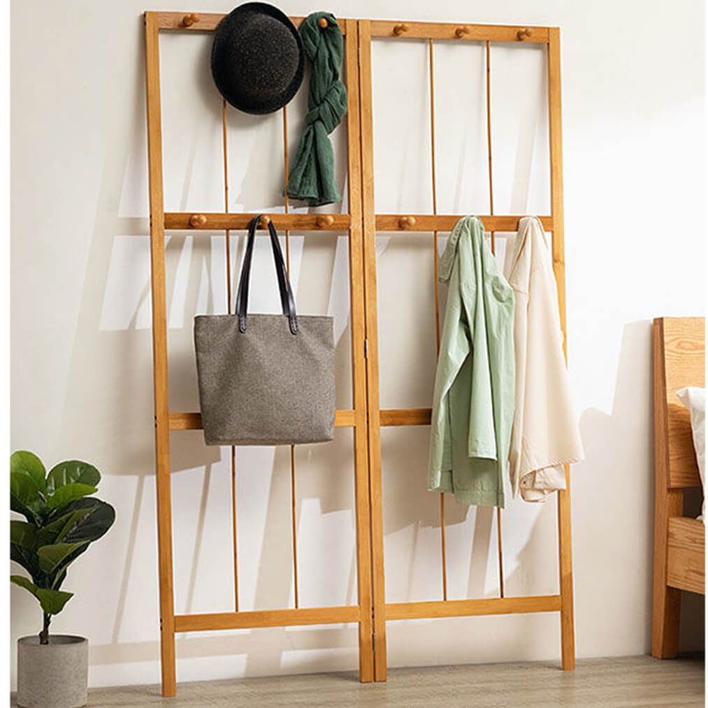 Close-up of bamboo hooks on the coat rack, ideal for hanging bags and accessories.