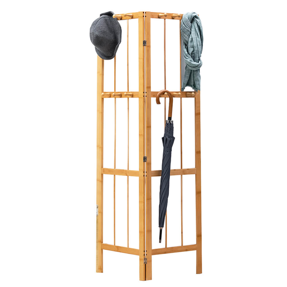 Folding bamboo coat stand placed in a corner, demonstrating its space-saving benefits.