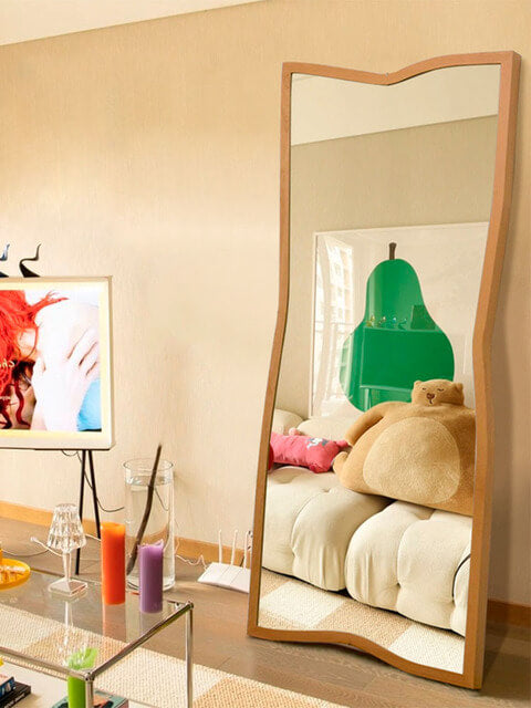 Elegant Nordic wooden frame standing mirror placed in a bright hallway