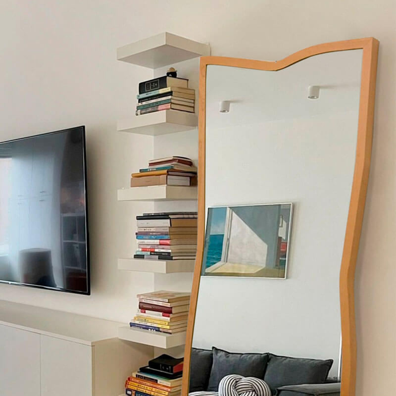 Modern Nordic design mirror reflecting a beautifully decorated room