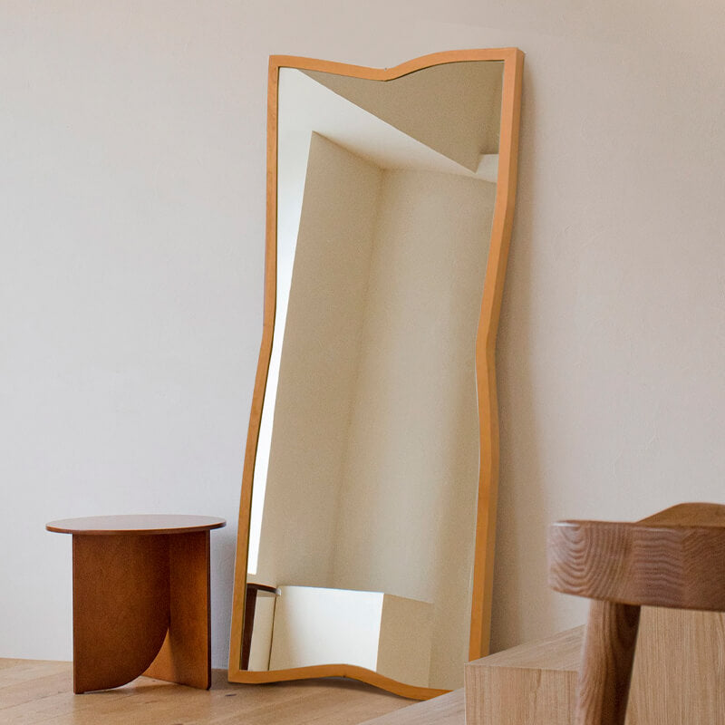 Elegant Nordic wooden frame standing mirror placed in a bright hallway