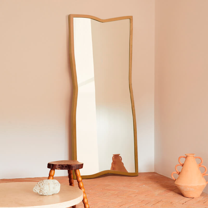Modern Nordic design mirror reflecting a beautifully decorated room