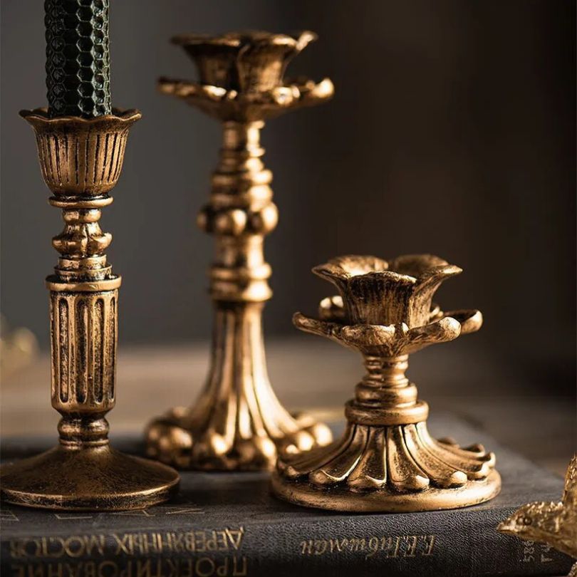 Close-up view of the vintage candle holder showcasing its antique resin finish.