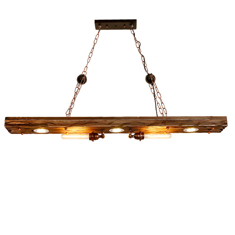 Heritage Glow pendant light hanging above a cozy reading corner featuring rustic furniture