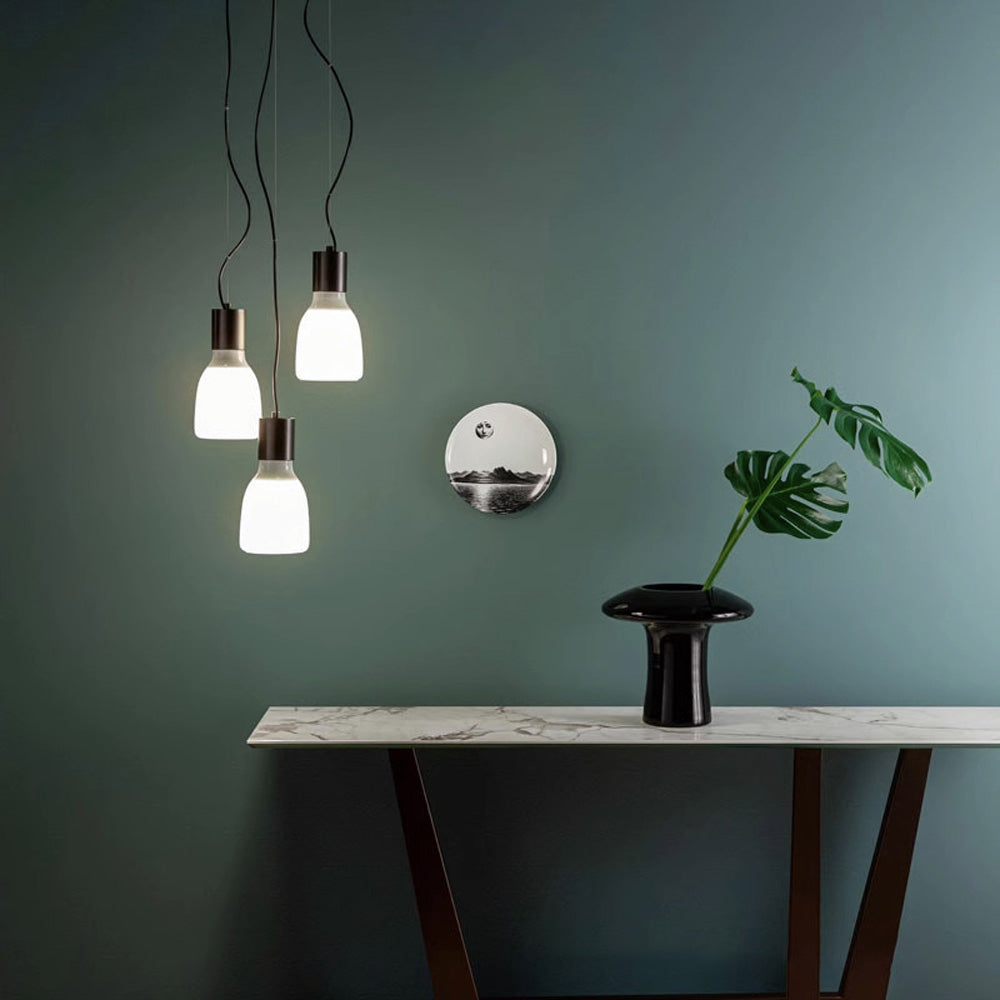 Close-up view of the green glass pendant light highlighting the unique hand-crafted workmanship and color variations.
