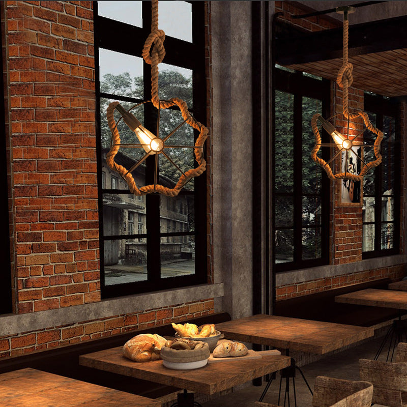 The hemp rope industrial pendant light hanging in a beautifully decorated living room.