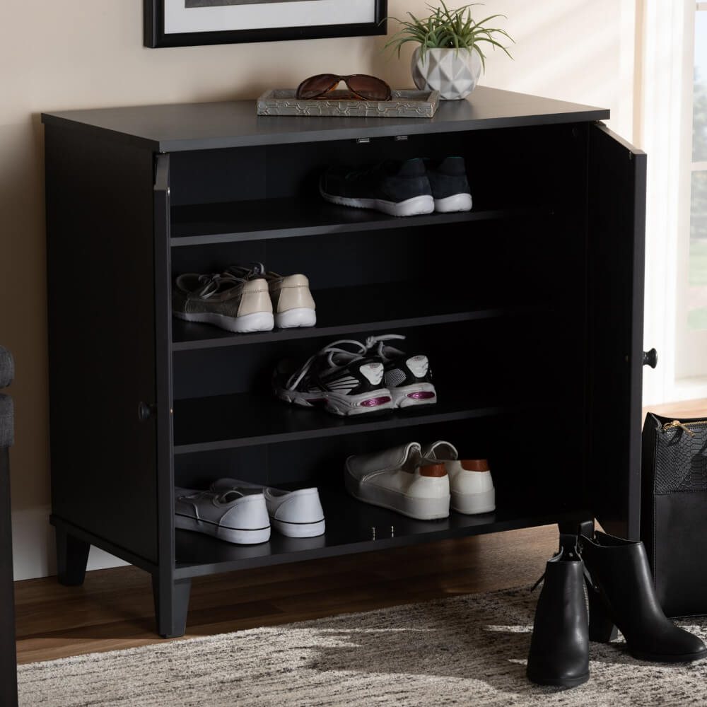 Close-up of the recessed grid pattern on the doors of the shoe cabinet.
