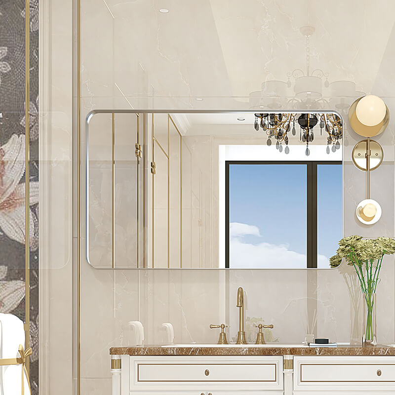 Elegant glossy silver rounded corner wall mirror showcasing its brushed metal frame and rounded edges.