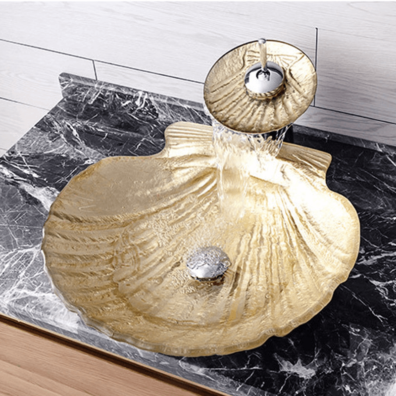 Close-up view of the luxurious gold finish on the tempered glass sink, perfect for modern bathroom aesthetics.