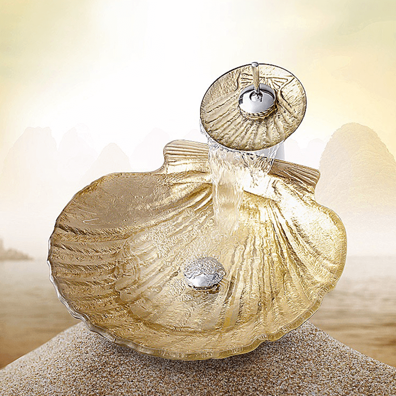 Gold ingot tempered glass vessel sink with waterfall faucet, showcasing its elegant design and smooth surface.
