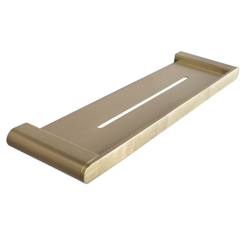 Gold floating shelf used as a plant holder, adding a touch of greenery to the bathroom space.