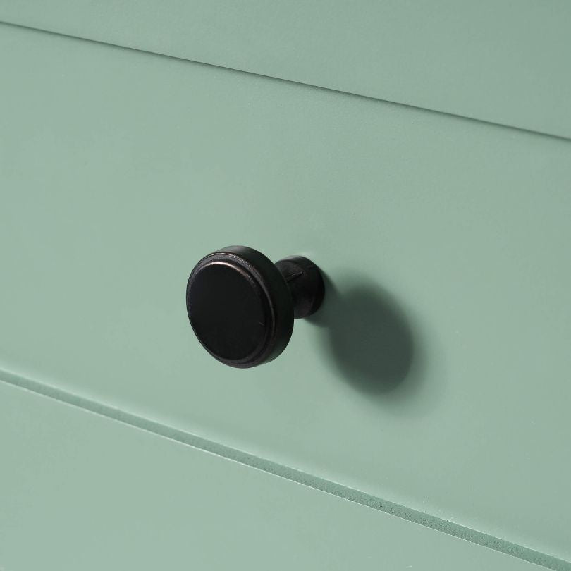 Tall storage cabinet in a vibrant green color, ideal for bathroom essentials.