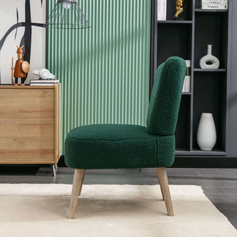 Close-up of the green teddy fabric accent chair, focusing on the tufted detailing and ergonomic backrest.