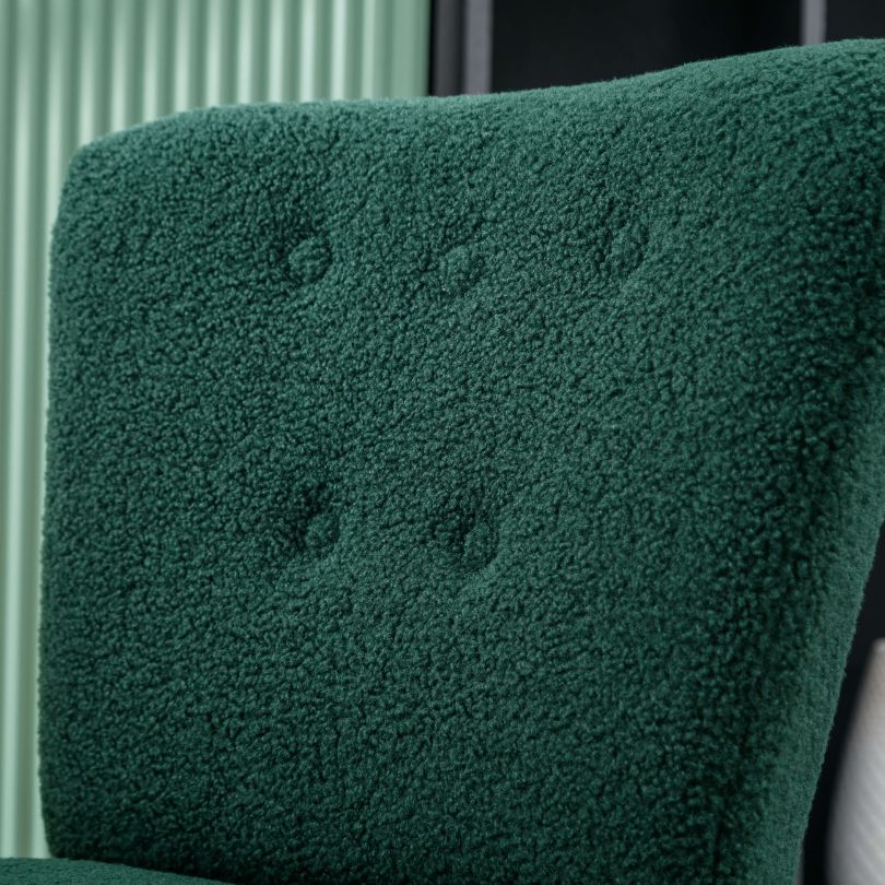 Close-up of the green teddy fabric accent chair, focusing on the tufted detailing and ergonomic backrest.