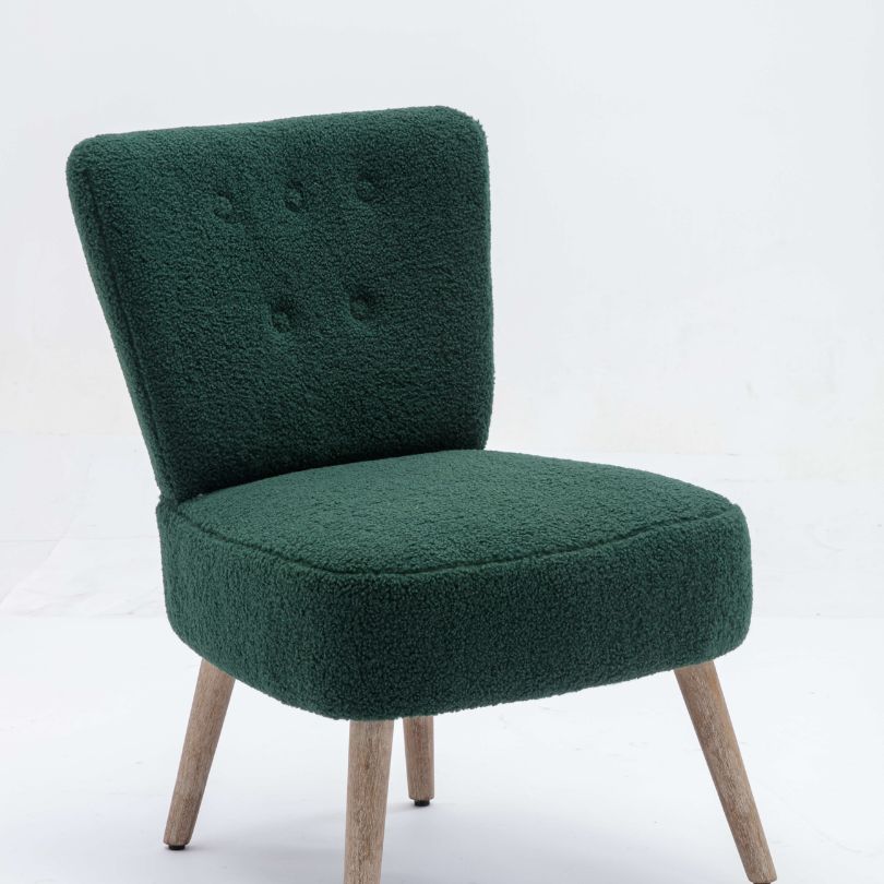 Close-up of the green teddy fabric accent chair, focusing on the tufted detailing and ergonomic backrest.