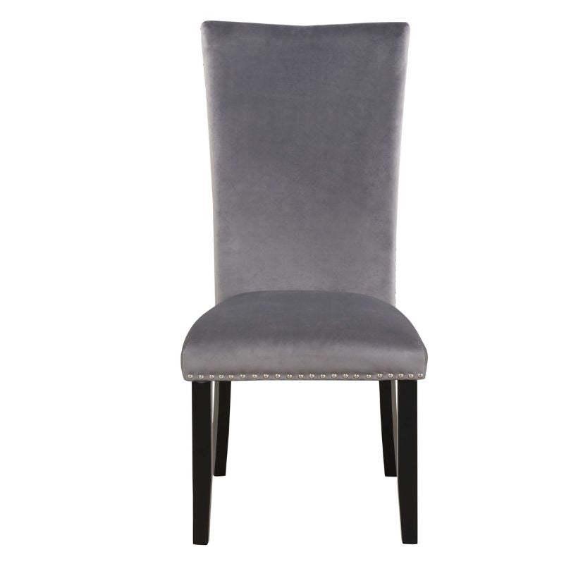 Armless grey velvet dining chair showcasing its sleek design and durable rubber wood legs.