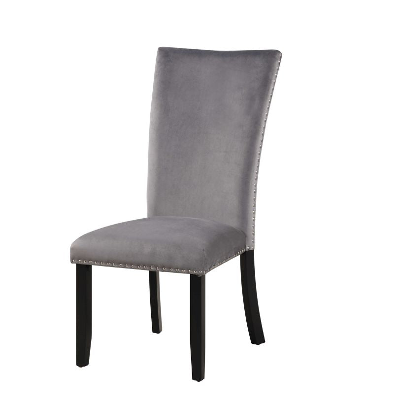 Armless grey velvet dining chair showcasing its sleek design and durable rubber wood legs.