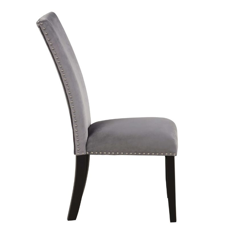 Elegant grey velvet dining chair set with nailhead trim, perfect for modern dining spaces.