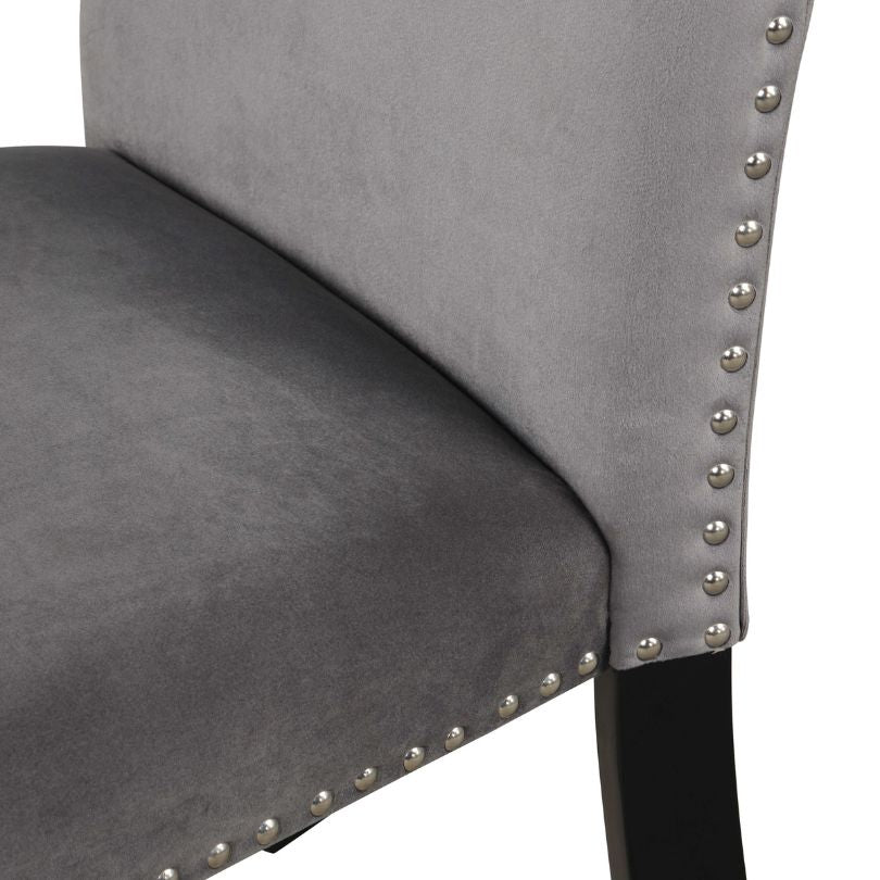 Elegant grey velvet dining chair set with nailhead trim, perfect for modern dining spaces.