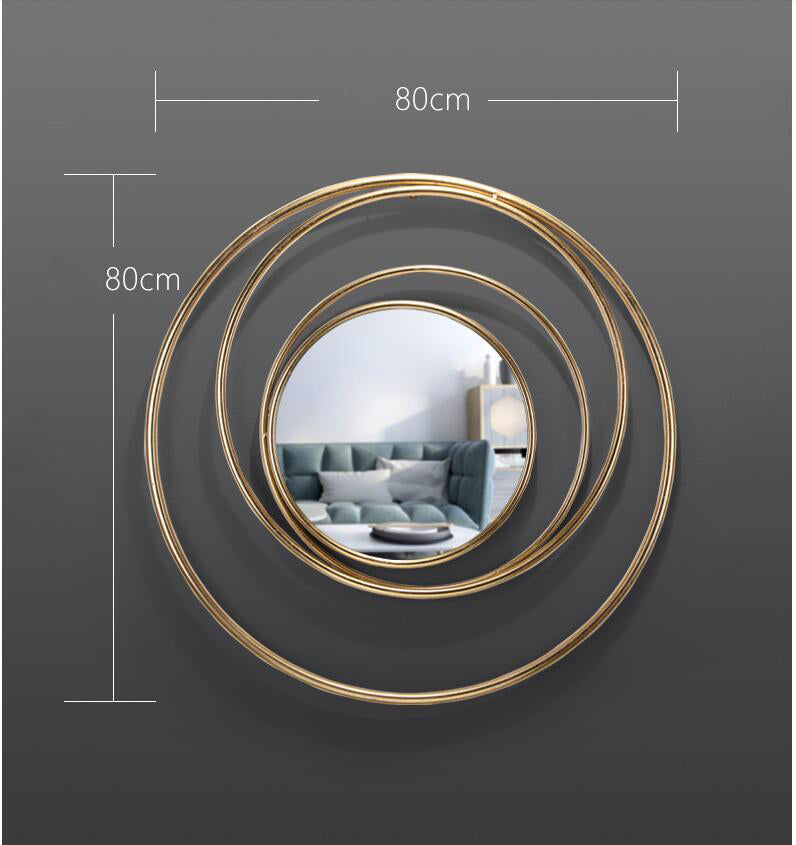 Close-up of the high-quality gold finish of the luxury circle mirror, showcasing its craftsmanship.