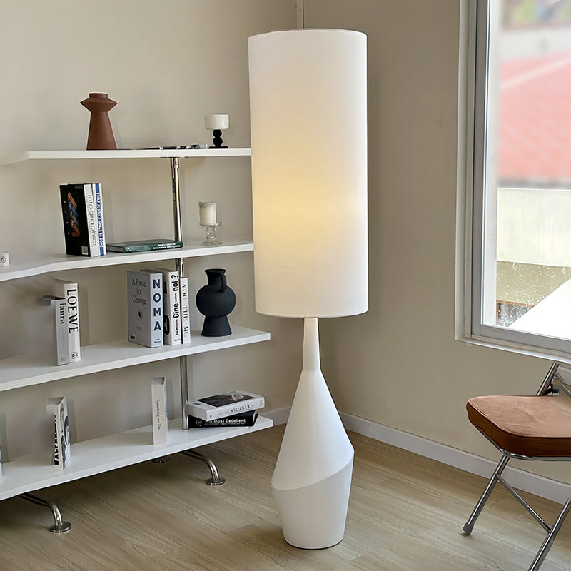 The Nordic Elegance Cream LED Floor Lamp showcasing its elegant design in a modern bedroom.