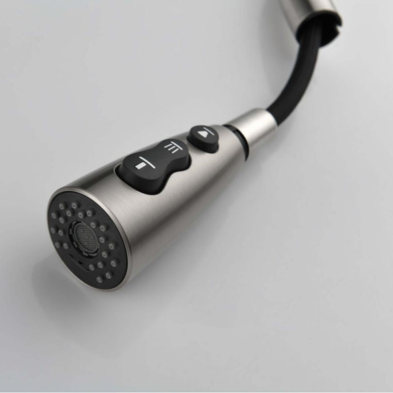 Close-up of the single handle mechanism of the high arc kitchen faucet with a brushed nickel finish.