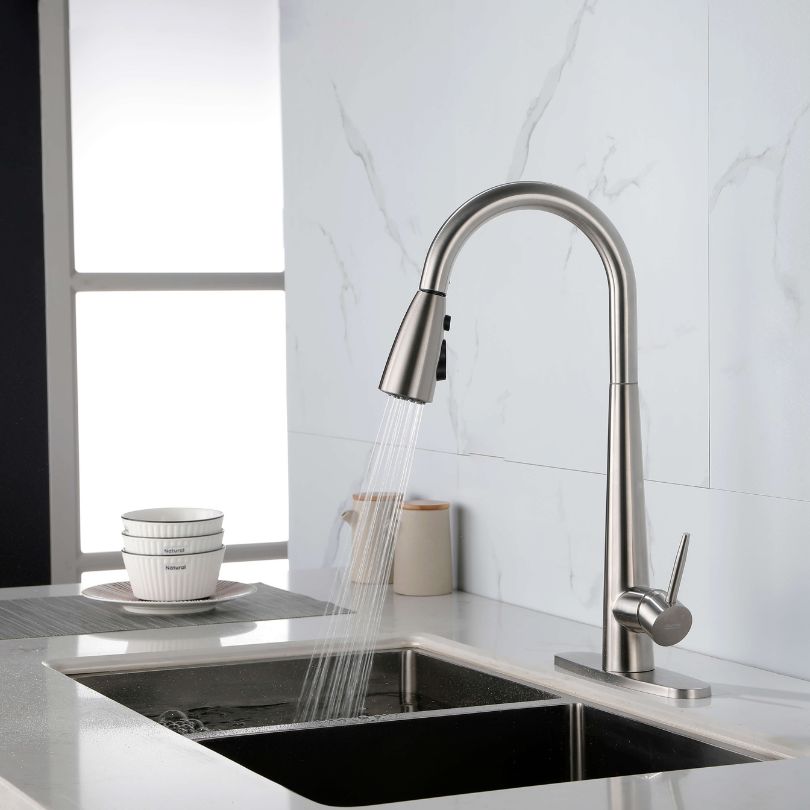 View of the high arc single handle kitchen faucet installed over a kitchen sink, demonstrating its functionality.