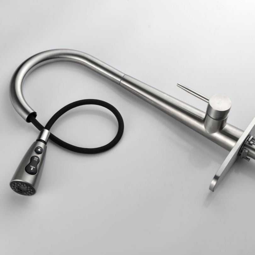 View of the high arc single handle kitchen faucet installed over a kitchen sink, demonstrating its functionality.