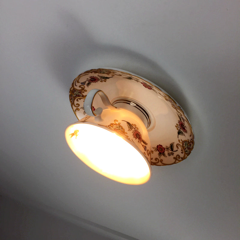 Chic ceramic flush mount light fixture showcasing modern design and illumination in a cozy living room.