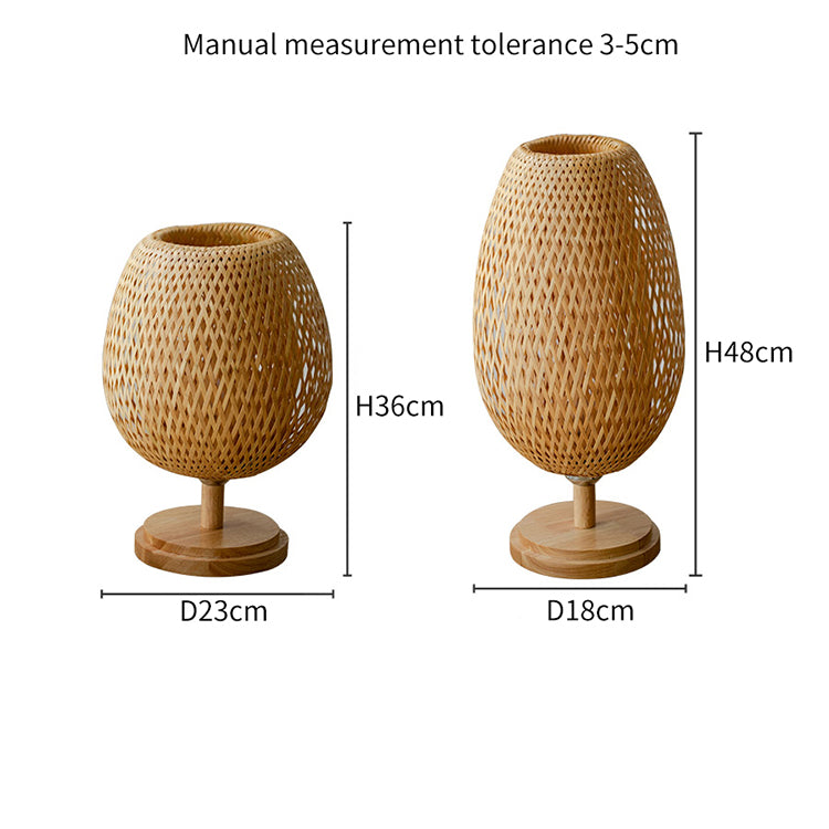 Front view of handwoven bamboo lamp with wooden base in a cozy bedroom setting.