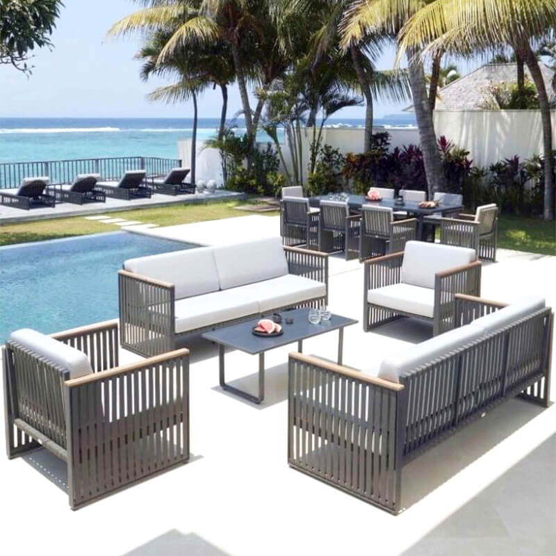 Close-up of the Horizon Outdoor Sofa showcasing the durable woven fibers and teak arms.