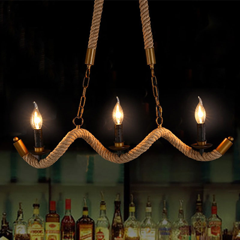 The pendant light illuminating a cozy hotel room, creating a warm and inviting atmosphere.
